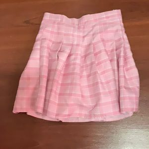 Mid length women’s pleated skirt in pink plaid